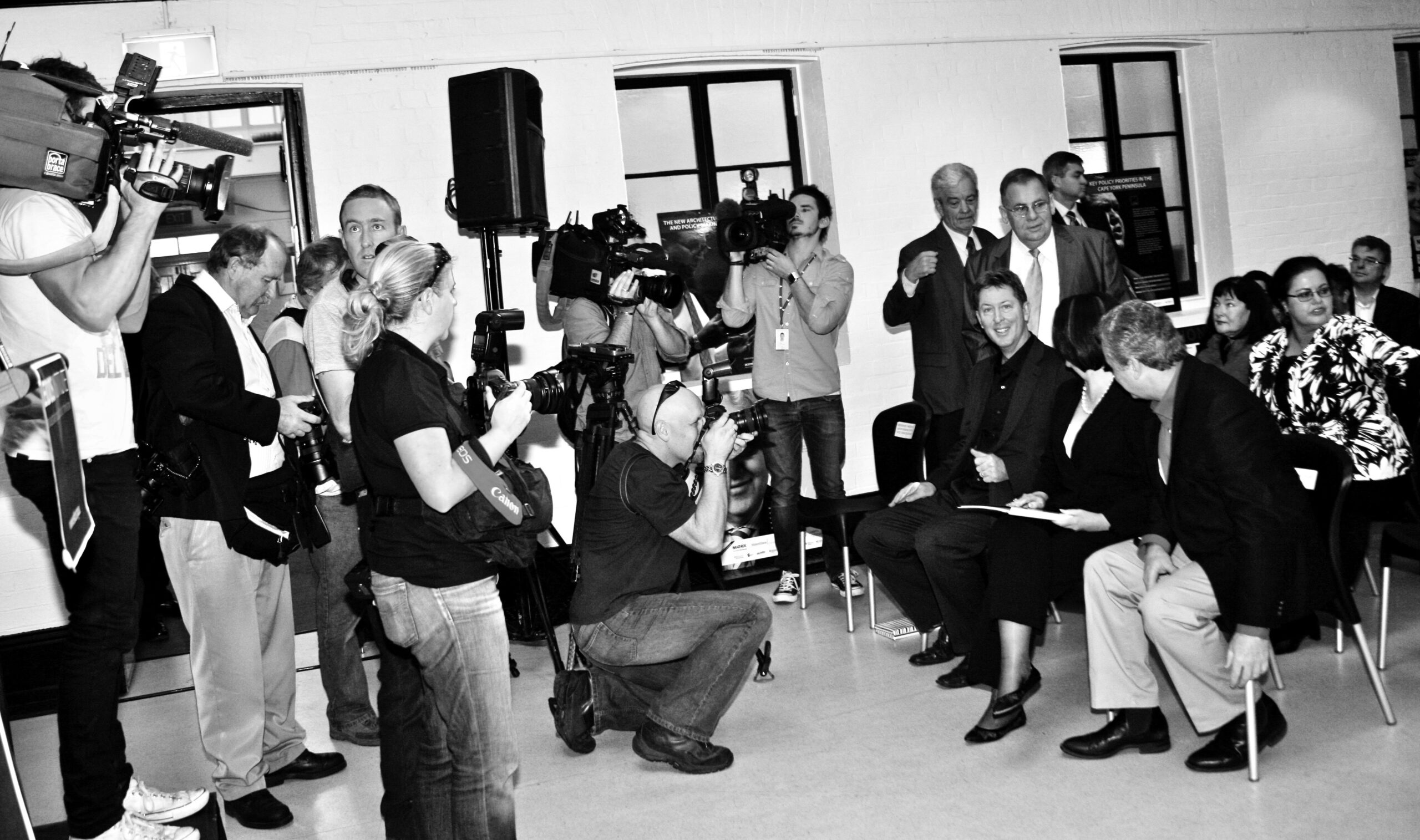 Bruce Muirhead with Prime Minister Julia Gillard at her speech at the School of Arts, Ann Street, Brisbane, Australia. Thought leaders gathered in crowd.